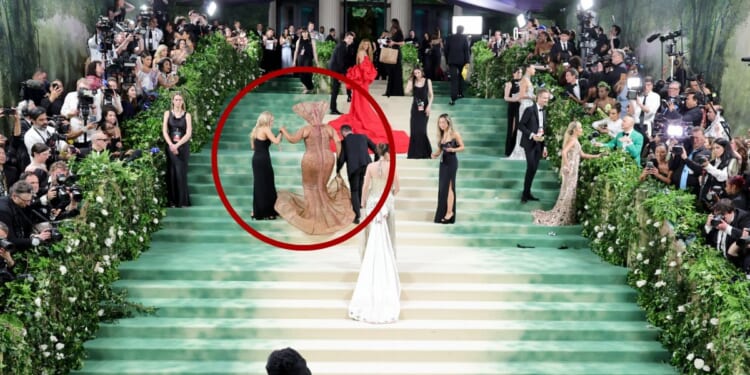 Workers at the Met Gala had to help several celebrities - including Lizzo, circled - up the stairs at The Metropolitan Museum of Art in New York City on Monday because their outfits did not allow them to walk upstairs on their own.