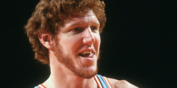 Bill Walton of the San Diego Clippers looks on against the Detroit Pistons during an NBA basketball game circa 1980 at the Pontiac Silverdome in Michigan.