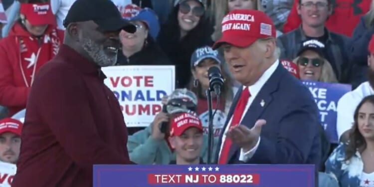 Former President Donald Trump, right, greets former NFL star Lawrence Taylor during a campaign event Saturday in Wildwood, New Jersey.