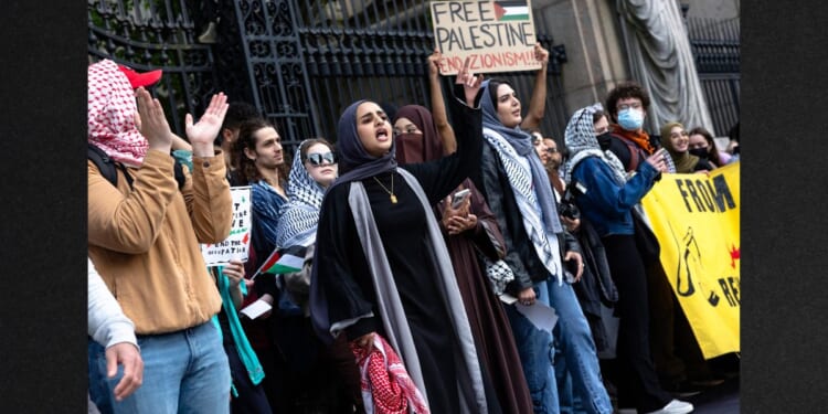 Pro-Palestinian protesters hold a rally outside of Columbia University on Tuesday in New York City.