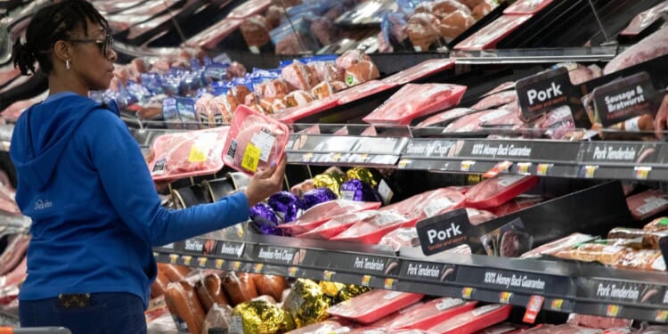 A customer shops at the meat counter at a Walmart in Levittown, New York, on April 24, 2019.