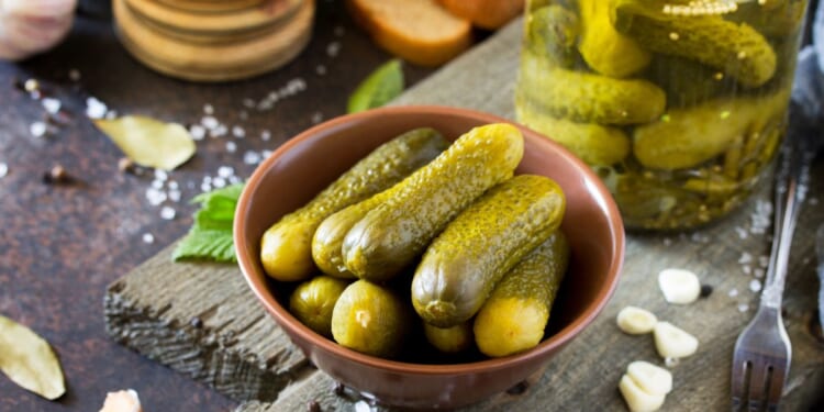 a stock image of a bowl of pickles