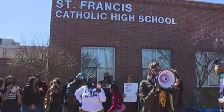 People protest over supposed "blackface" by students at St. Francis High School in Mountain View, California.