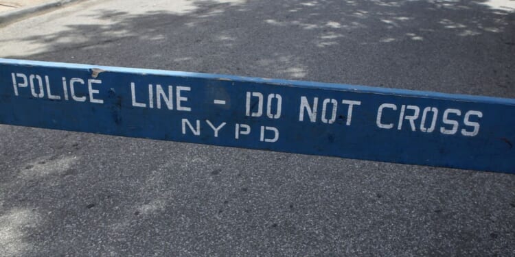 A police barricade stands in New York City in this stock photo. On Thursday, authorities said a 71-year-old pedestrian was killed during a police chase in the city.