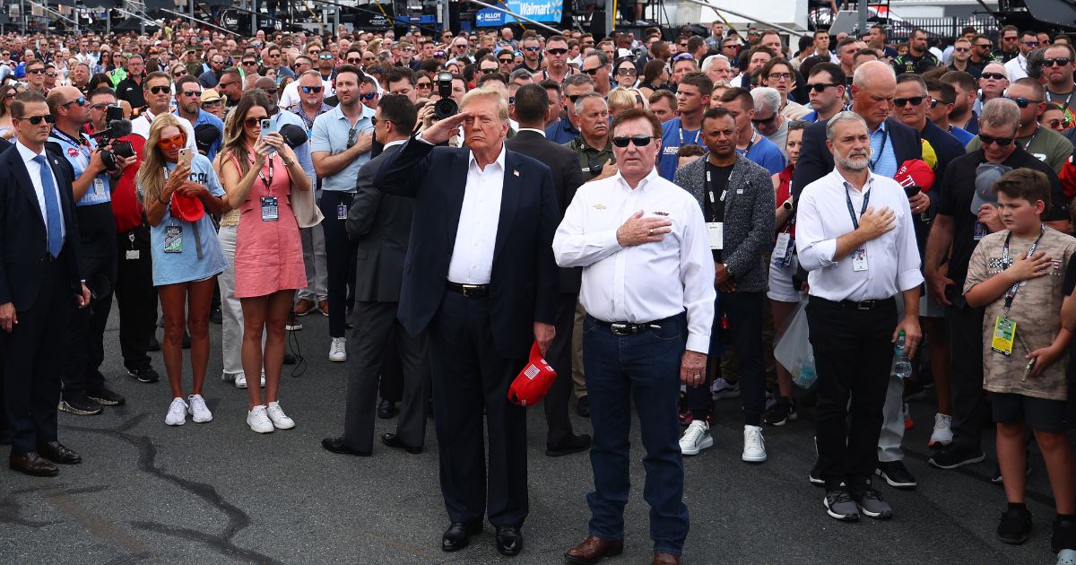 Former U.S. President and Republican presidential candidate Donald Trump stands on the grid with NASCAR team owner Richard Childress prior to the NASCAR Cup Series Coca-Cola 600 at Charlotte Motor Speedway on May 26, 2024 in Concord, North Carolina.