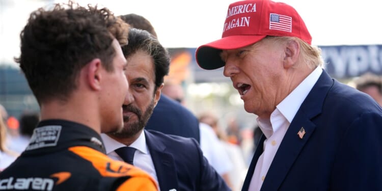 Donald Trump talking with driver Lando Norris of Britain after Norris won the Miami Formula One Grand Prix