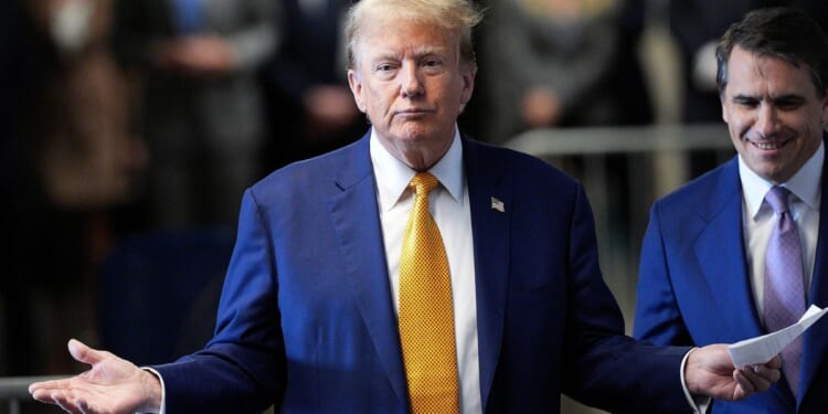 Former President Donald Trump speaks to the media before he appears in court during his trial at the Manhattan Criminal Court in New York City on Tuesday.