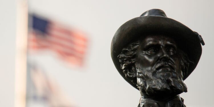 The American Flag flies behind the statue of Confederate General Thomas Stonewall Jackson stands at the West Virginia State Capitol Complex on August 16, 2017 in Charleston, West Virginia.