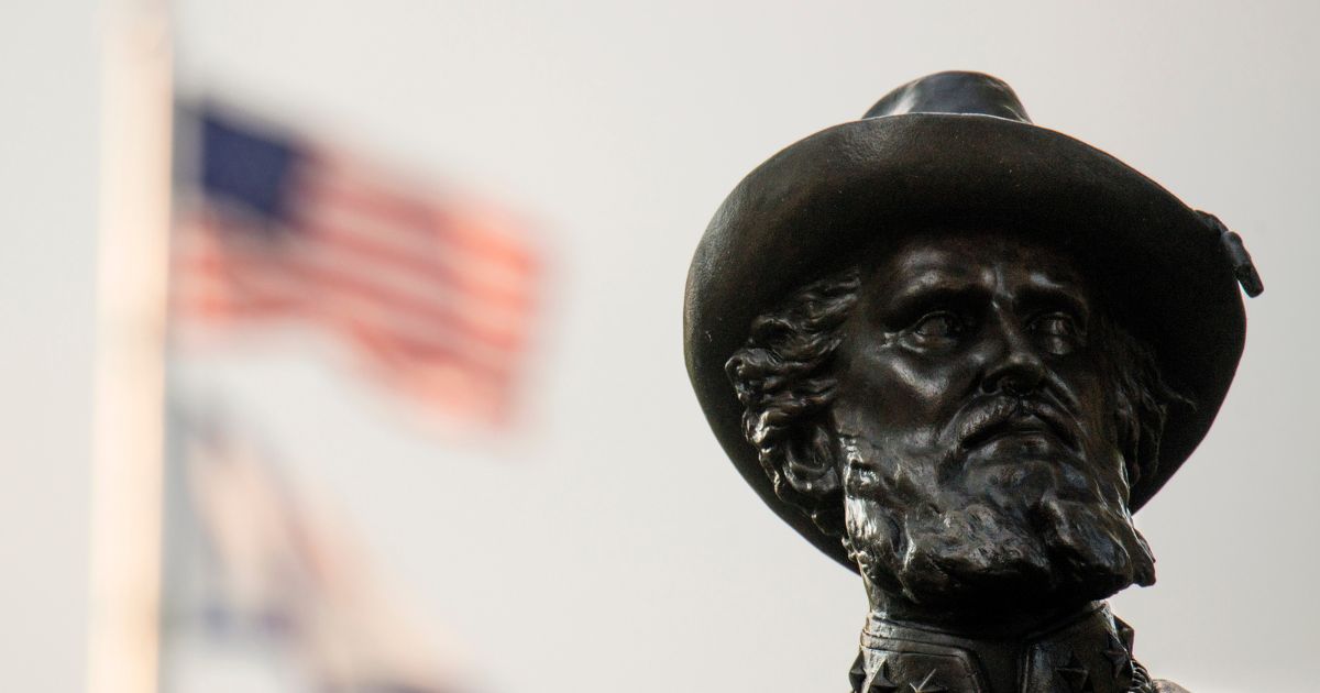 The American Flag flies behind the statue of Confederate General Thomas Stonewall Jackson stands at the West Virginia State Capitol Complex on August 16, 2017 in Charleston, West Virginia.