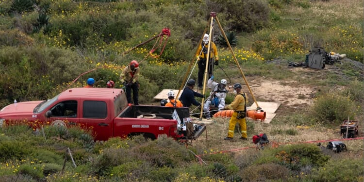 Investigators on the scene at a well on Friday in the Mexican state of Baja California where the bodies of a missing American and two Australian brothers were found.