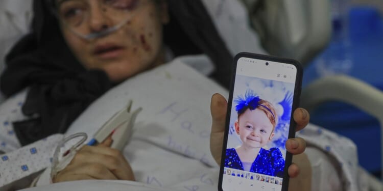 Lebanese village mourning children and father killed in Israeli strike