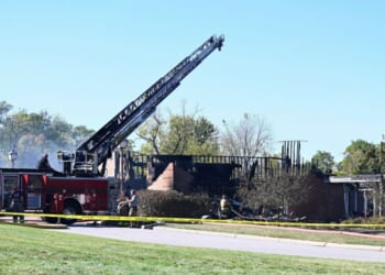 Law enforcement officers guard the area near where the attack took place at a Latter-day Saints church in Grand Blanc, Michigan, on Sept. 28, 2025.
