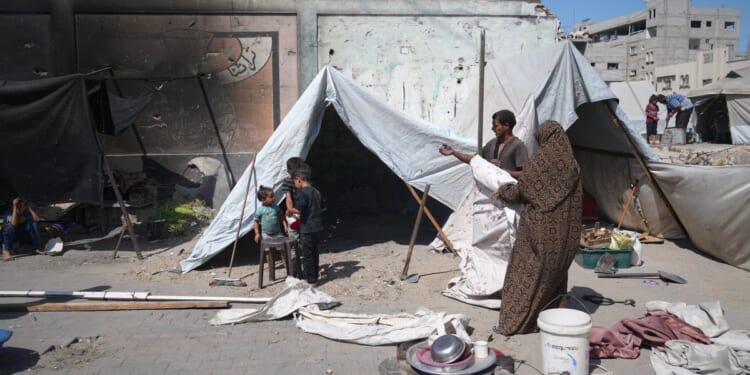 Israel troops kill at least 31 Palestinians in Gaza as Trump peace proposal raises questions