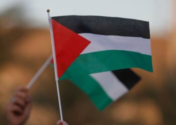 Iraqi citizens raise Palestinian flags during an anti-Israel rally in Baghdad on Sept. 23, 2025.