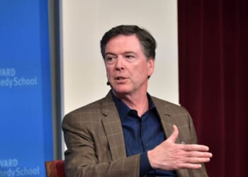 Former FBI Director James Comey speaks at Harvard Kennedy School with Harvard's Eric Rosenbach on Feb. 24, 2020, in Boston, Massachusetts.