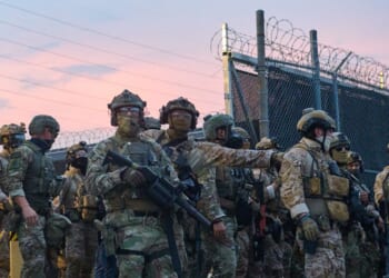 Federal agents confront protesters gathered outside of the suburban Chicago ICE Detention Center in Broadview, Illinois, on Sept. 19, 2025.