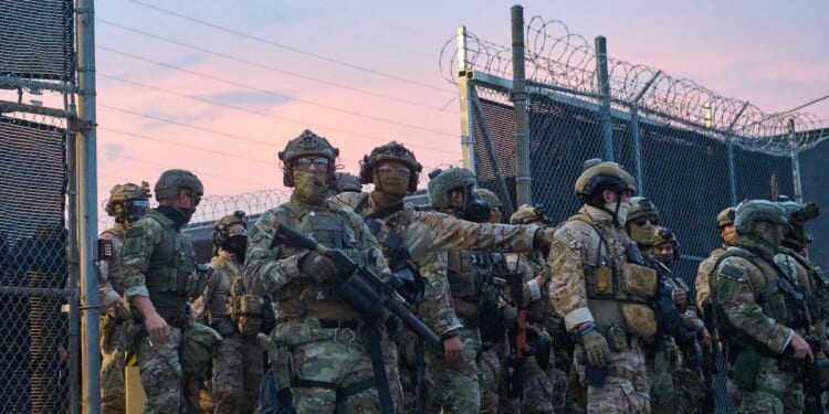 Federal agents confront protesters gathered outside of the suburban Chicago ICE Detention Center in Broadview, Illinois, on Sept. 19, 2025.