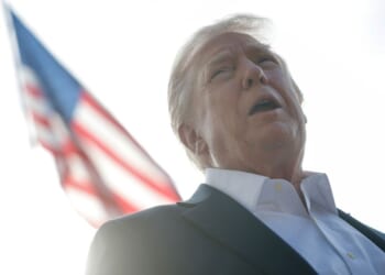President Donald Trump speaks to members of the media as he departs the White House in Washington, D.C., on Friday.