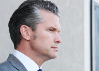Secretary of War Pete Hegseth waits to greet Canadian National Defense Minister David McGuinty during an advanced honor cordon at the Pentagon on Sept. 22, 2025, in Arlington, Virginia.