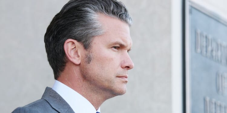 Secretary of War Pete Hegseth waits to greet Canadian National Defense Minister David McGuinty during an advanced honor cordon at the Pentagon on Sept. 22, 2025, in Arlington, Virginia.