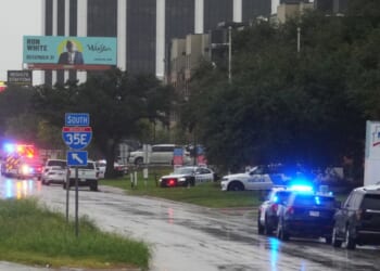 Police block off I-35E close to a U.S. Immigration and Customs Enforcement office after a shooting in Dallas, Texas, on Wednesday.