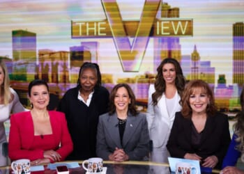 The cast of "The View" huddles around former Vice President Kamala Harris in New York on Oct. 8, 2024.