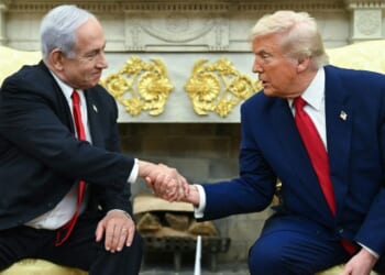 Israeli Prime Minister Benjamin Netanyahu, left, and President Donald Trump, right, shake hands during a meeting in the Oval Office of the White House in Washington, D.C., on April 7.