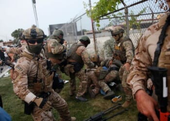 Immigration and Customs Enforcement and Enforcement and Removal Operations agents clash with demonstrators during a protest outside an ICE processing center in Broadview, Illinois, on Sept. 19, 2025.