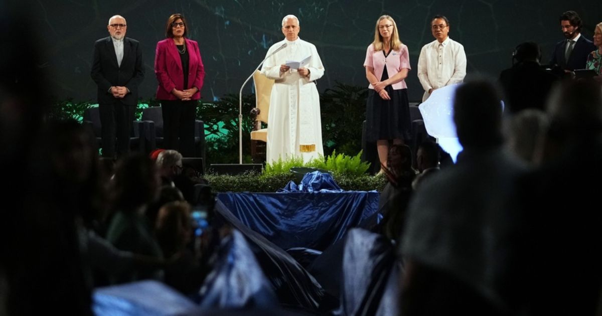 Pope Leo XIV, center, attends the International conference "Raising Hope for Climate Justice", in Castel Gandolfo, Italy, on Wednesday.