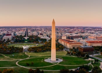 The National Mall in Washington, D.C., is photographed from a helicopter at sunset.