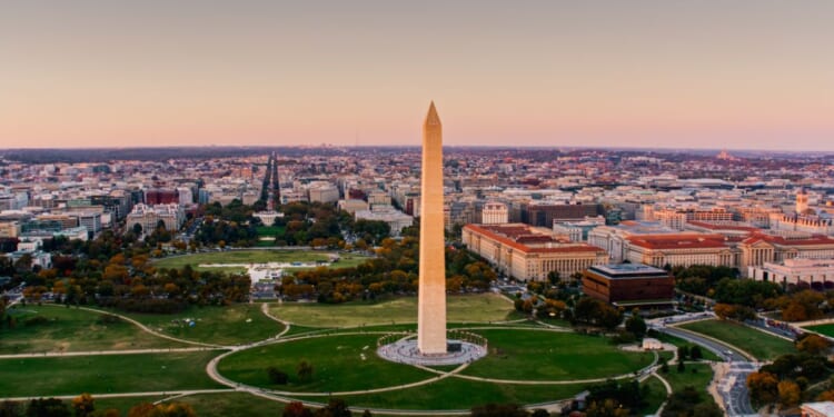 The National Mall in Washington, D.C., is photographed from a helicopter at sunset.