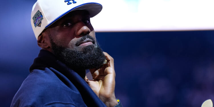 Los Angeles Lakers' Lebron James stands on the court before an NBA basketball preseason game against the Golden State Warriors in San Francisco, California, on Sunday.
