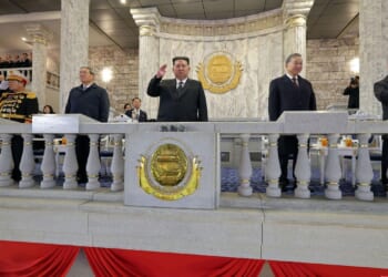 North Korea celebrating Kim Jong-un with military parade featuring new long-range missile