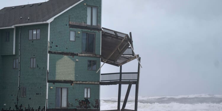 Dozens rescued as remnants of typhoon slam Alaska while nor'easter brings flooding to East Coast