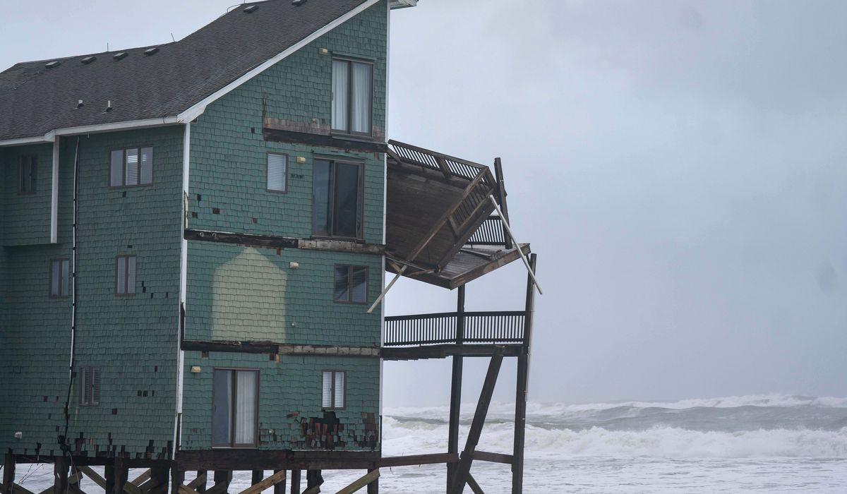 Dozens rescued as remnants of typhoon slam Alaska while nor'easter brings flooding to East Coast