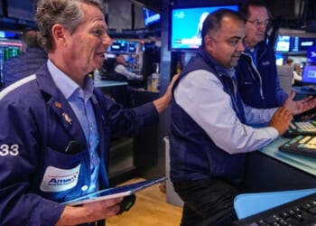 Wall Street rises and nears its record