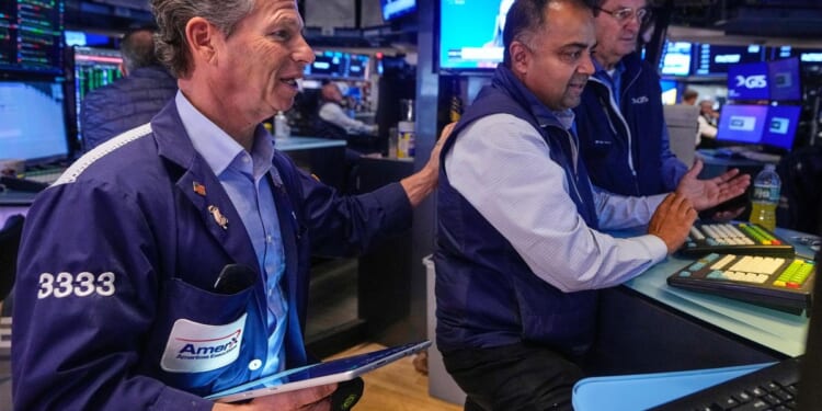 Wall Street rises and nears its record