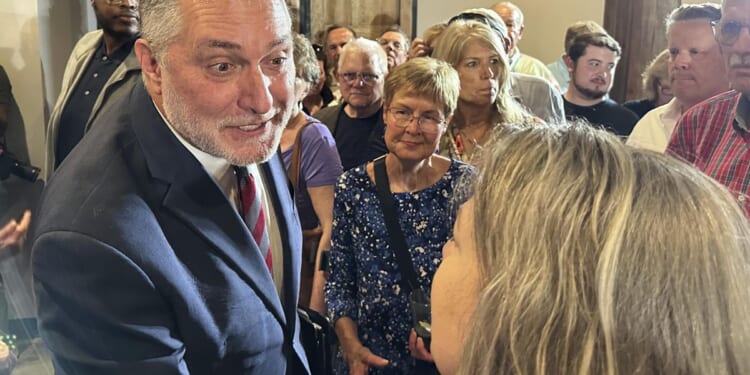 John Reid puts an AI twist on empty-chair debate routine in Virginia's lieutenant governor race