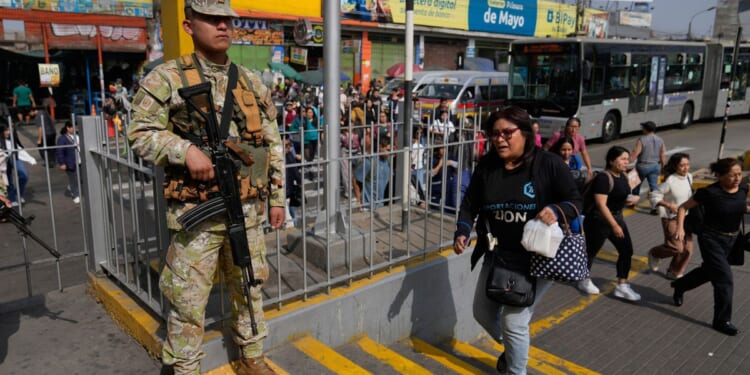 Military and police patrol streets of Peru's capital as state of emergency begins