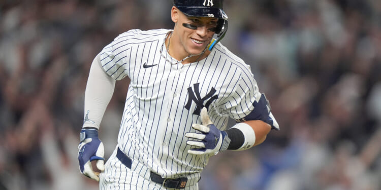 New York Yankees' Aaron Judge reacts as he rounds the bases after hitting a three-run home run against the Toronto Blue Jays during the fourth inning of Game 3 of baseball's American League Division Series in New York on Tuesday.