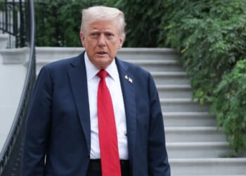 President Donald Trump walks toward members of the media before answering questions while departing the White House on Sept. 30, 2025, in Washington, D.C.