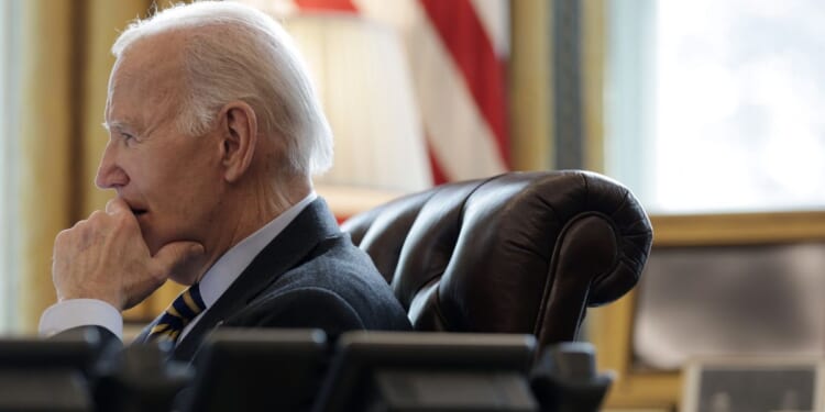 President Joe Biden listens during a briefing in the Oval Office of the White House in Washington, DC on Jan. 10, 2025.