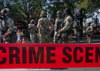 Federal law enforcement agents are confronted and surrounded by far-left protesters in the Brighton Park neighborhood of Broadview, Illinois, on Saturday.