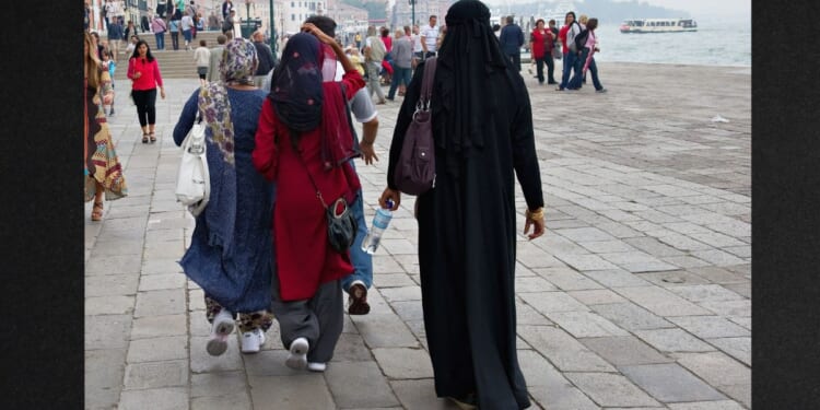 Women wearing veils and burquas walk in Venice, Italy, in a file photo from June 1, 2011.
