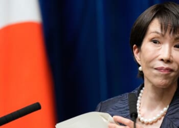 Japanese Prime Minister Sanae Takaichi listens to a journalist during a news conference in Tokyo on Oct. 21, 2025.