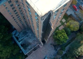 A high-rise apartment building partially collapsed after a suspected gas explosion in New York City on Wednesday.