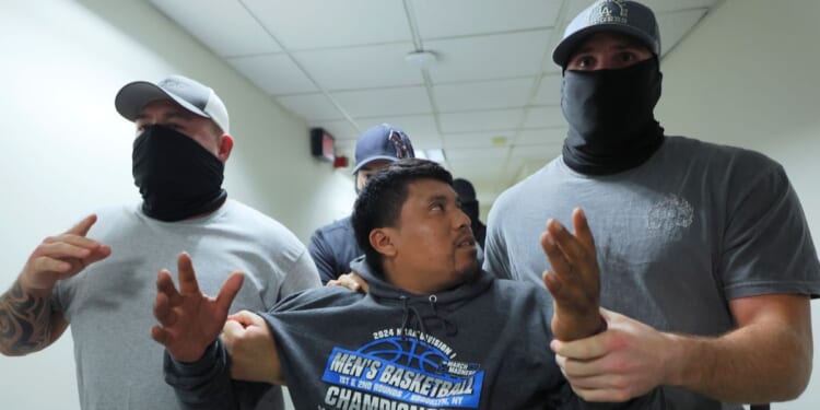 A man is detained by ICE agents after leaving a court hearing in immigration court at the Jacob K. Javitz Federal Building in New York City on Aug. 26.