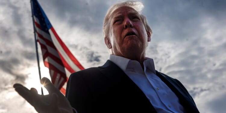 President Donald Trump speaks to members of the media as he departs the White House in Washington, D.C., on Sept. 26.