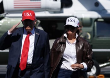 President Donald Trump and first lady Melania Trump arrive on the deck of the USS George H.W. Bush aircraft carrier in Naval Station Norfolk, Virginia, on Sunday.