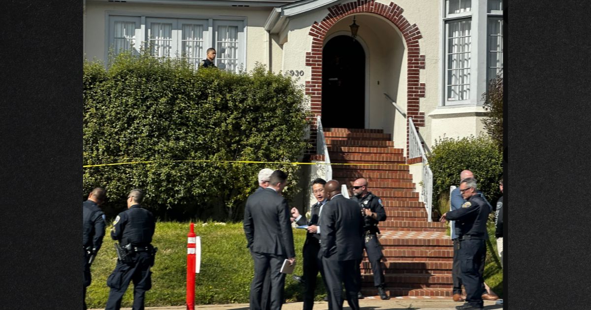 Investigators gather outside a San Francisco home where four bodies were found, including two children.